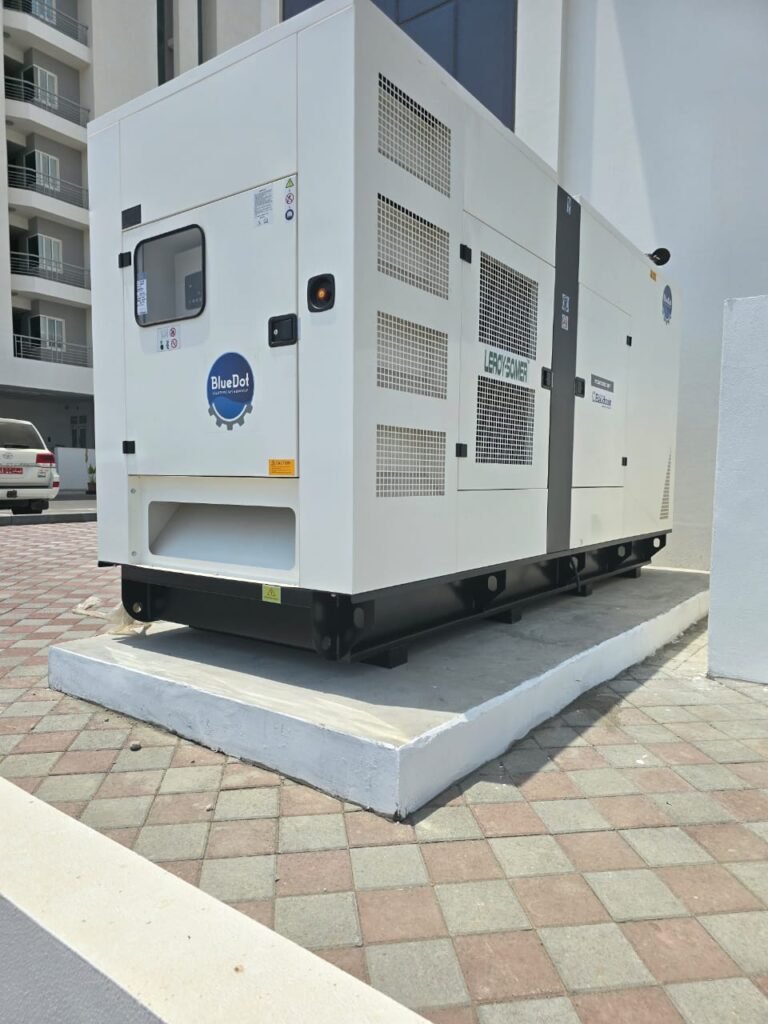A white diesel generator in open area.
