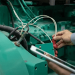 A guy doing maintenance in generator