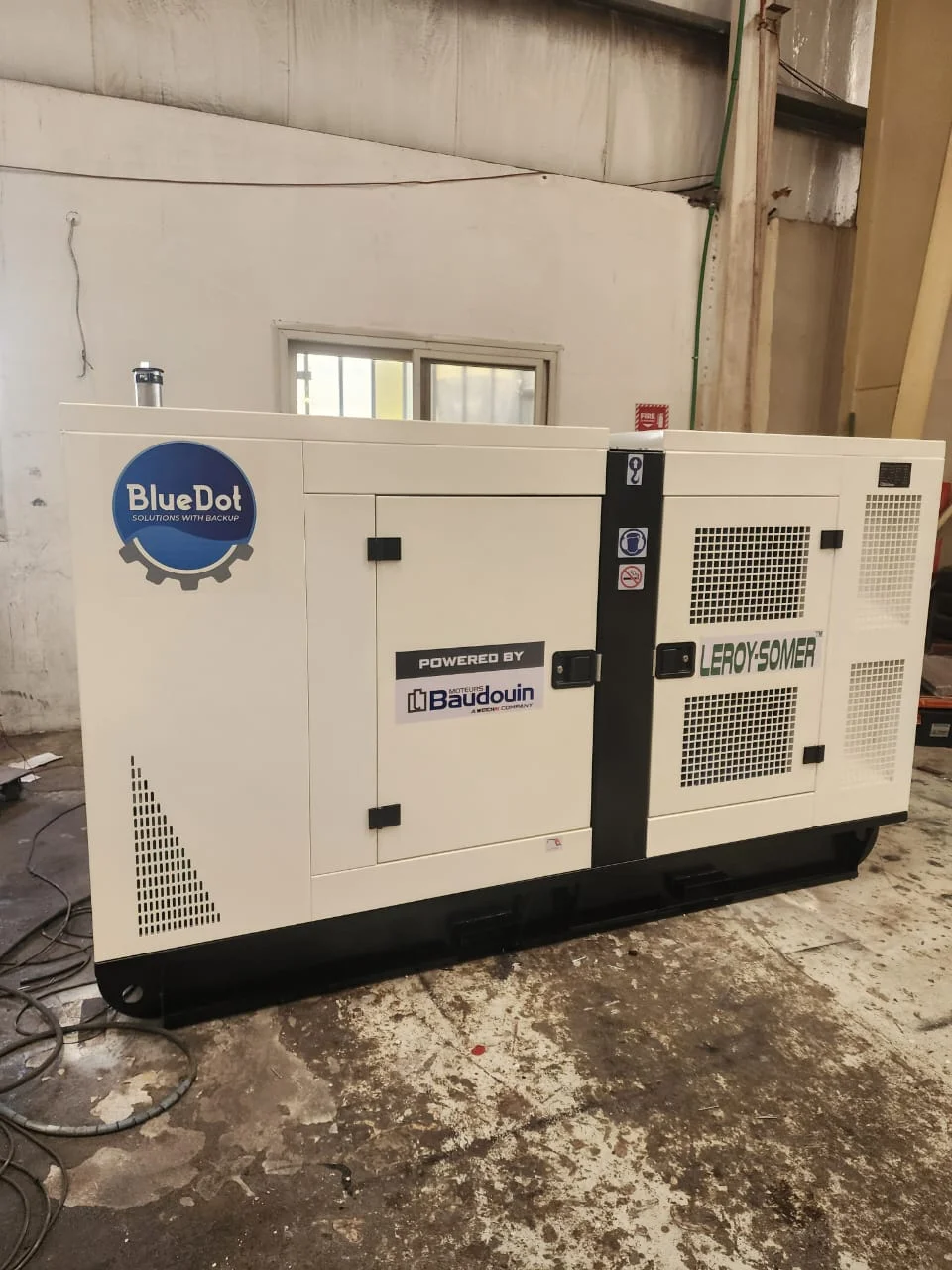 Blue dot diesel generator set on surface.